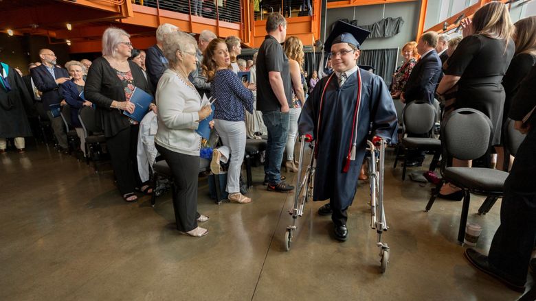 man processing in using a walker