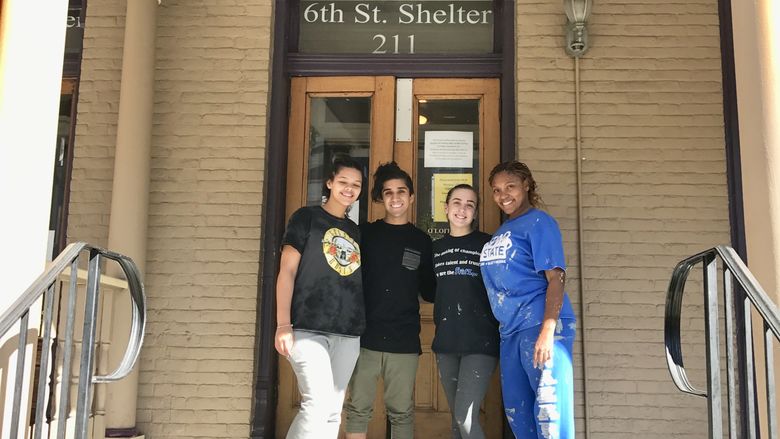volunteers outside of homeless shelter