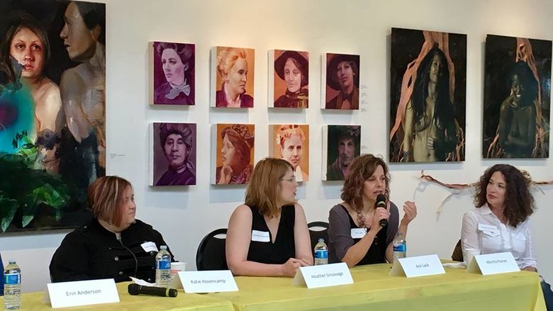 four panelists at a table