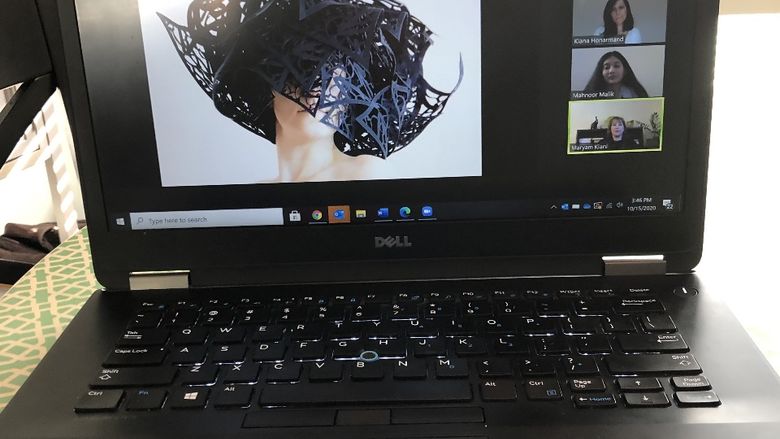 photo of laptop while on zoom event featuring artwork