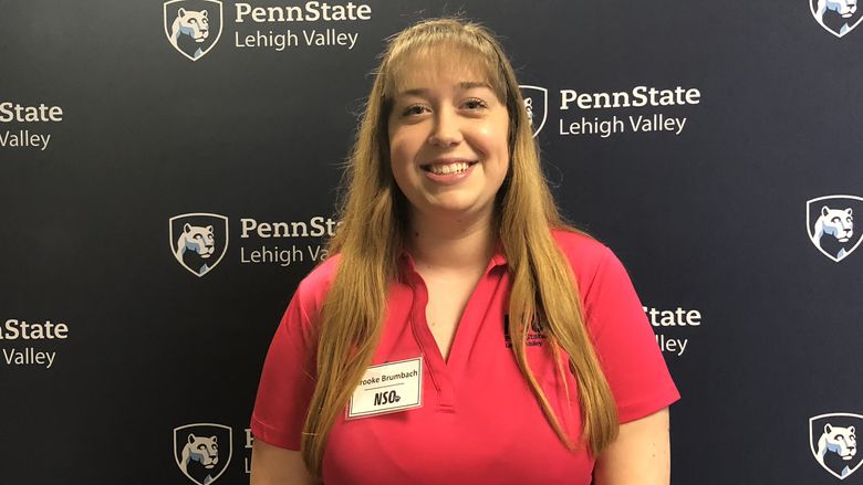 Young woman standing in front of Penn State Lehigh Valley backdrop