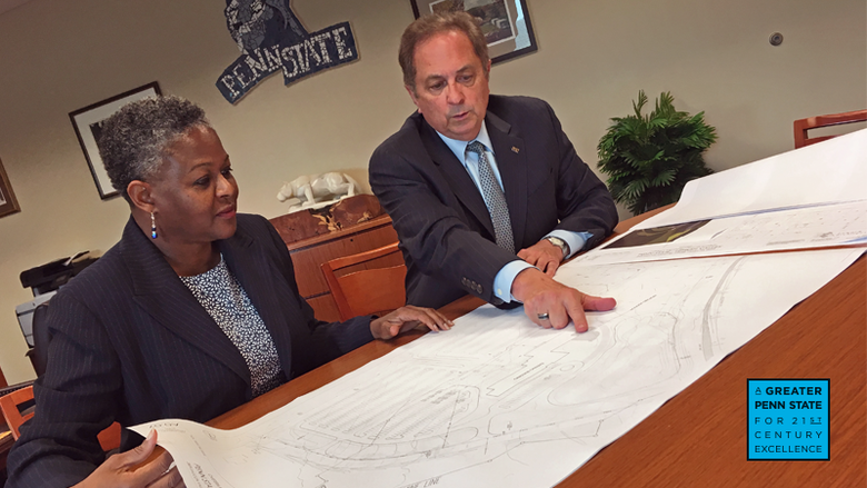 Dr. Richardson and Howard Kulp looking at blueprints
