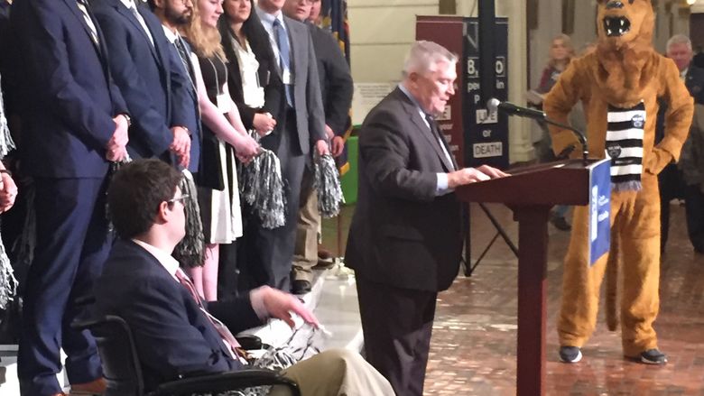 group of students standing with PSU President Barron