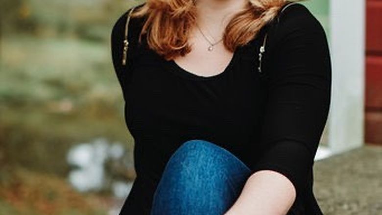 female student sitting outside