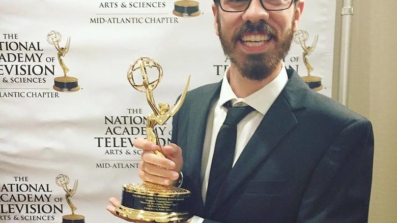 Carlo Acerra holding his Emmy