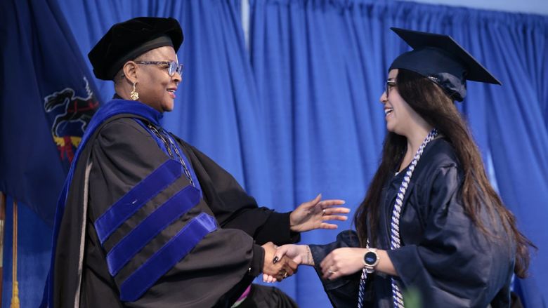Chancellor Richardson embraces Student Marshal 
