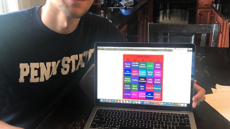 young man with his laptop playing bingo online