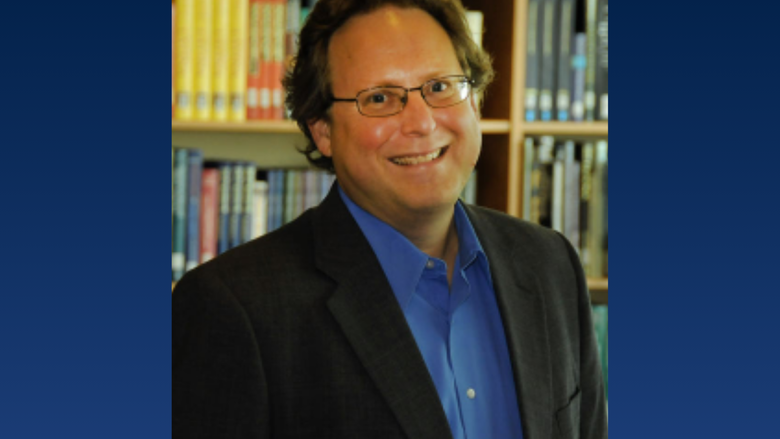 a headshot of a professor