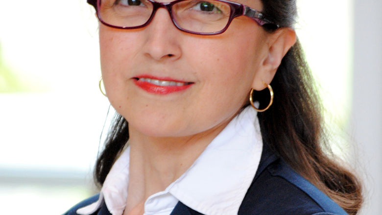 head shot of woman in glasses