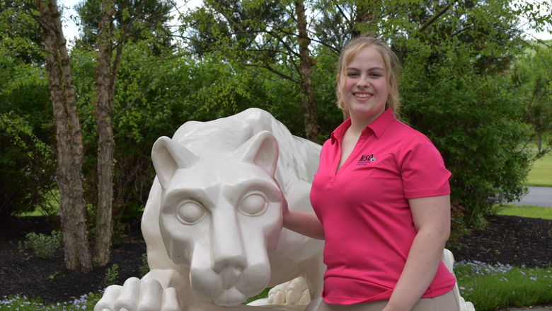 girl standing at Nittany Lion Shrine