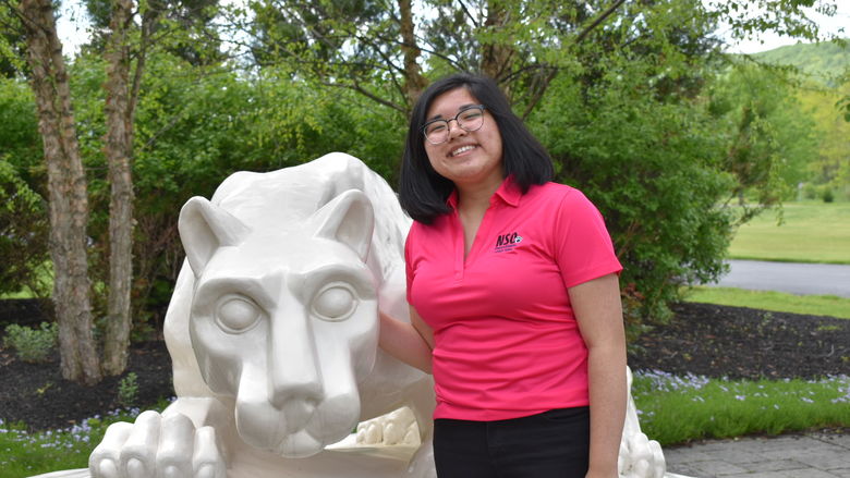 girl standing at Nittany Lion Shrine