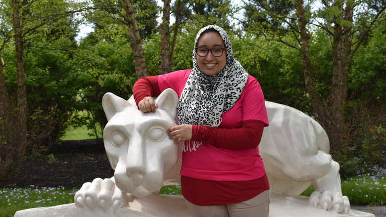 girl standing at Nittany Lion Shrine