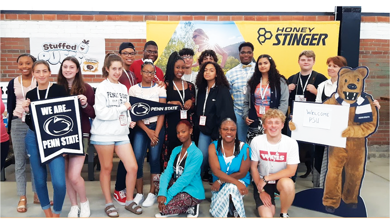 A group of students post for a photograph