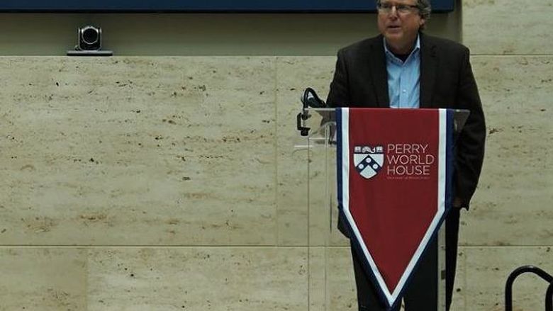 professor presenting behind podium