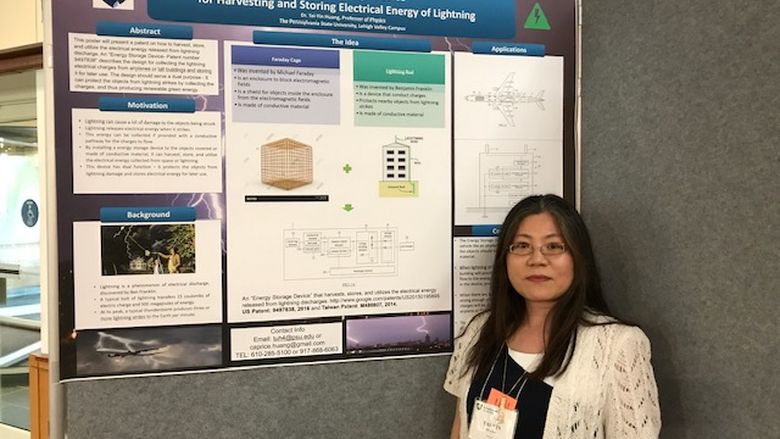 woman in front of a research poster
