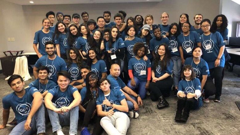 group of students in matching blue t-shirts