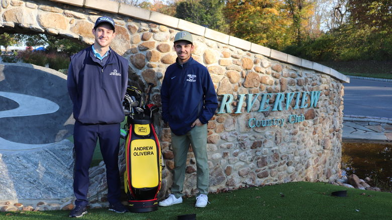 Two men outside country club wall