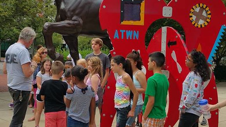 heart sculpture with people