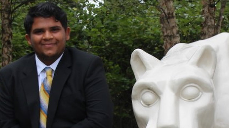 Hemil Patel in front of lion statue