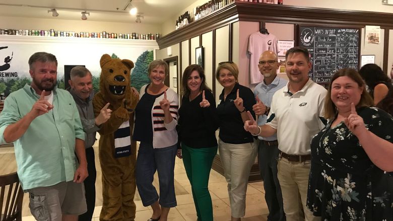 group of people with Nittany lion