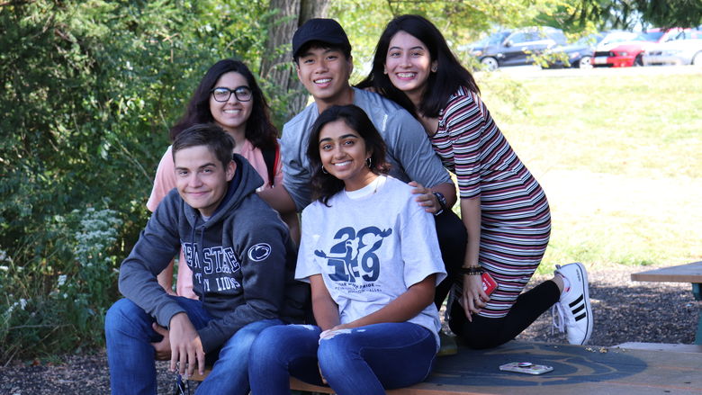 group of students on picnic table