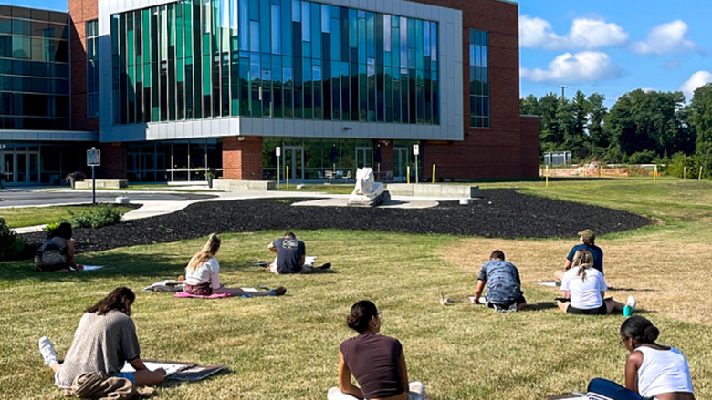 Students Outside Drawing PSU-LV's Expansion