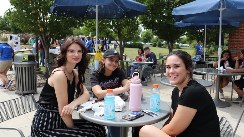 young women sitting at a table