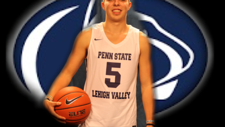 young man holding basketball