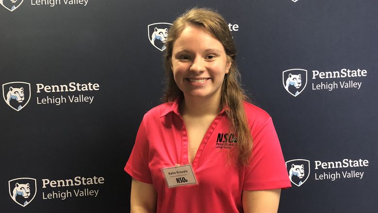 Young woman standing in front of Penn State Lehigh Valley backdrop