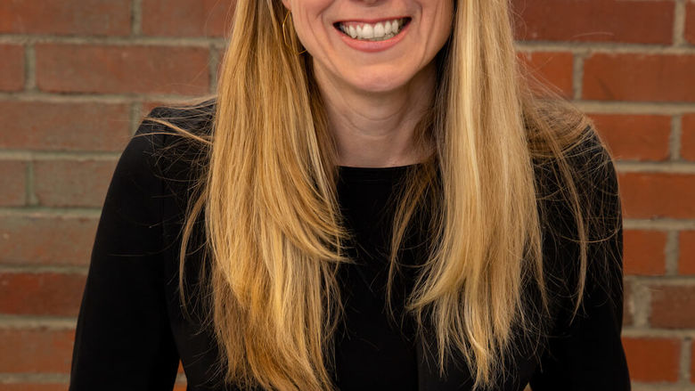head shot of woman in glasses