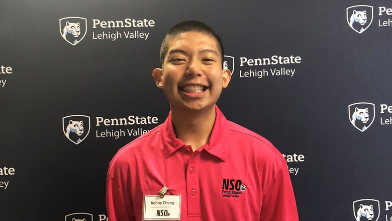 Young man standing in front of Penn State Lehigh Valley backdrop