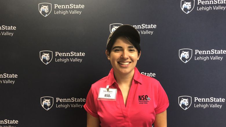 Young woman standing in front of Penn State Lehigh Valley backdrop