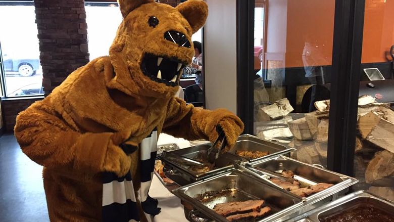 Nittany Lion next to BBQ food
