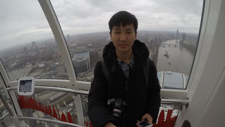Young man taking a selfie on the London Eye