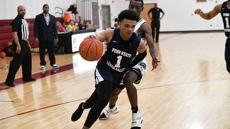 man dribbling down court