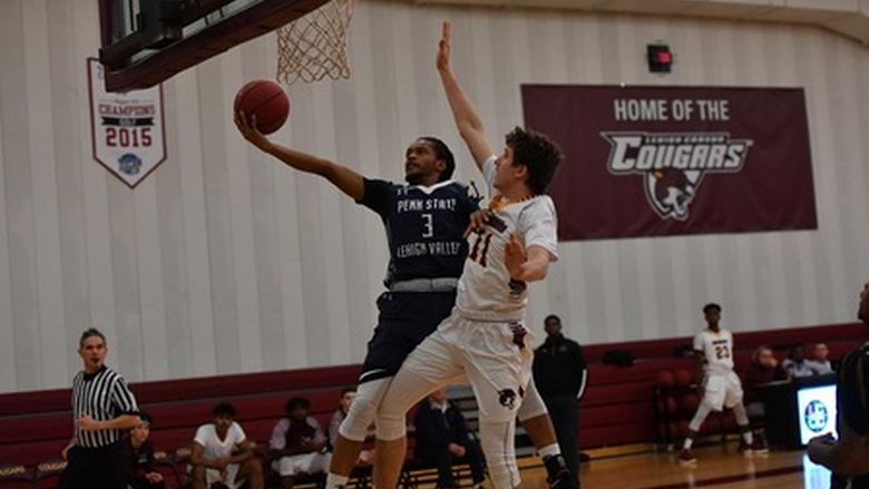 basketball player jumping to shoot a basket