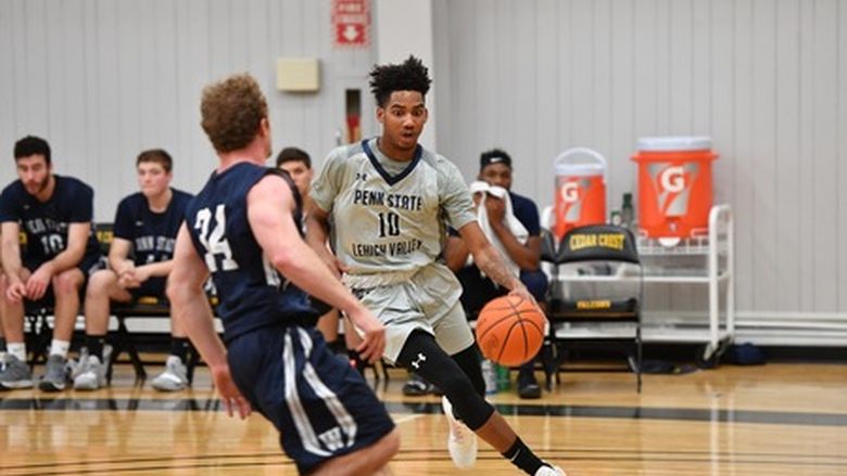 male basketball player dribbling