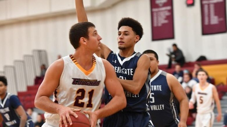 two men playing basketball