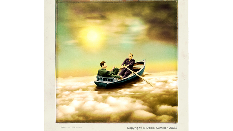 An image of two men in a boat moving downstream