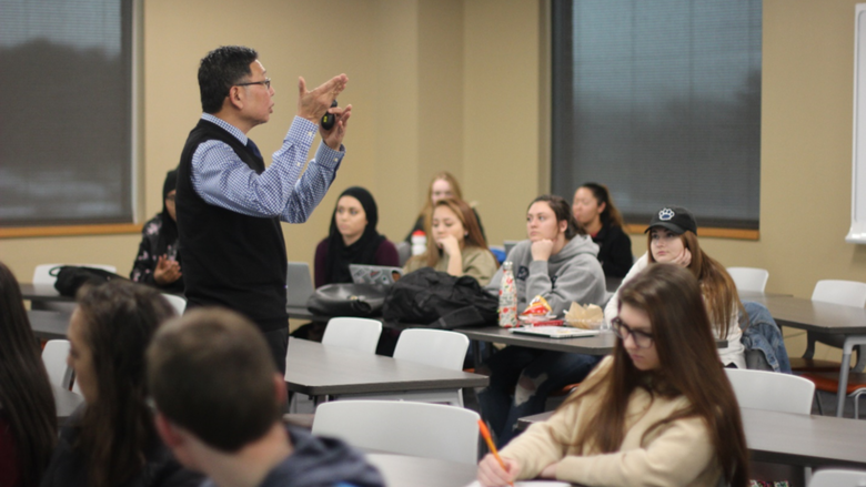 man teaching in classroom