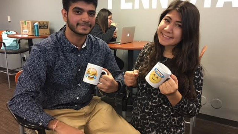 Students with their emoji mugs