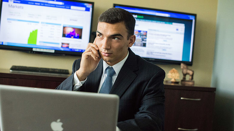 Nick Miller at a desk