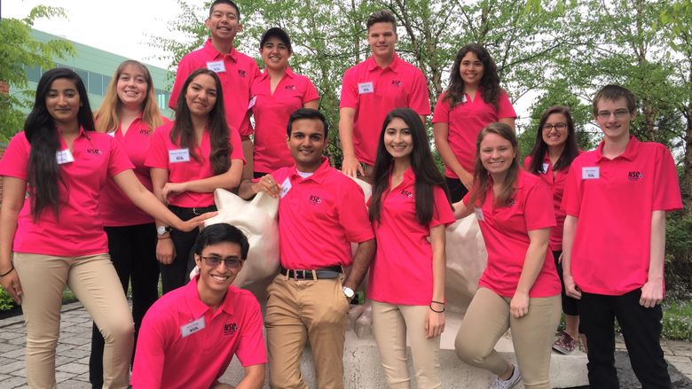 group of students in front of the lion shrine 