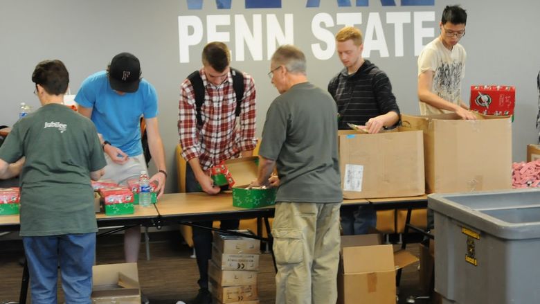 Student box up donated items