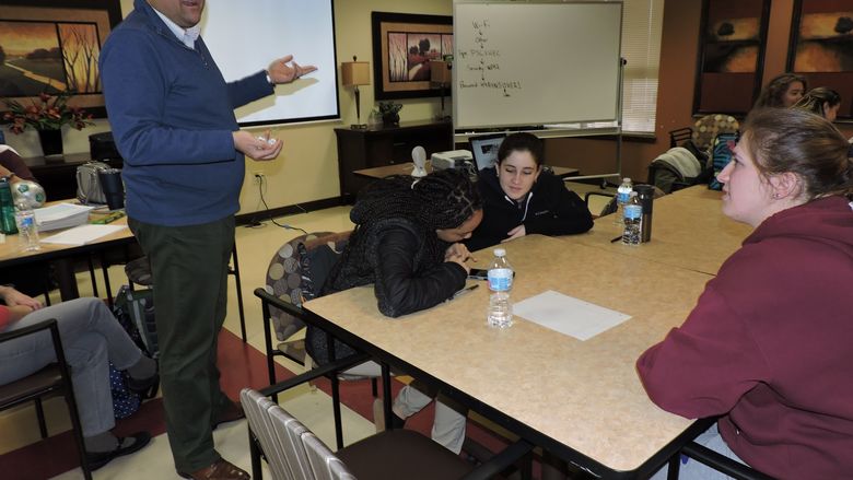 instructor talking to students
