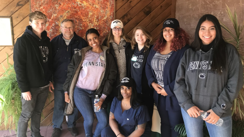group of students and professor at food bank