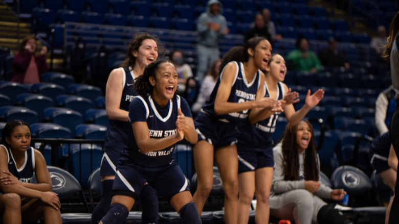 Women's Basketball teaming cheering and clapping