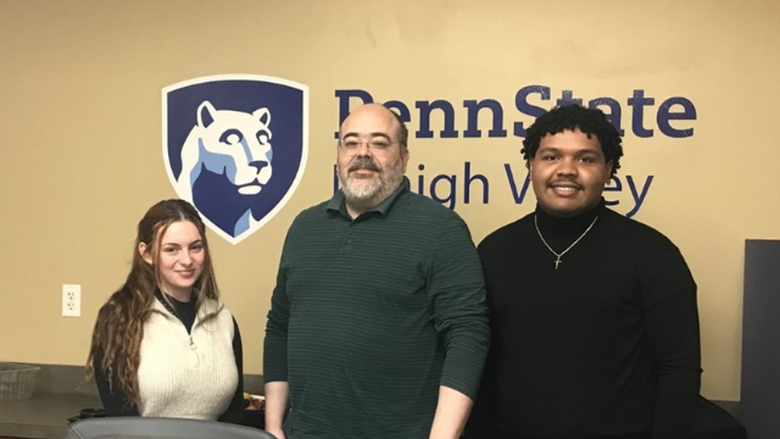 PSU-LV students Gianna Gomes and Fernando Gaton Bido with Dr. Anibal Torres