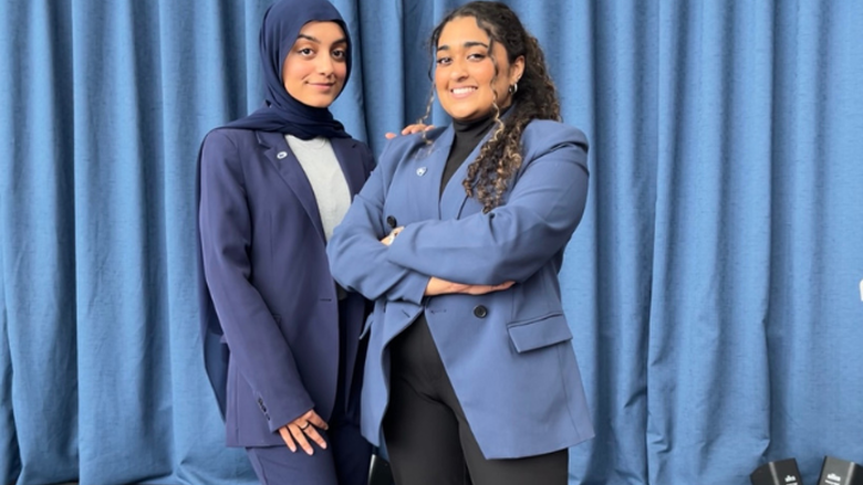Sabiha Kermalli and Huda Khan standing on stage