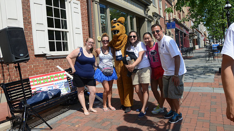 Nittany Lion posed with a group of people during Penn State Lehigh Valley Day